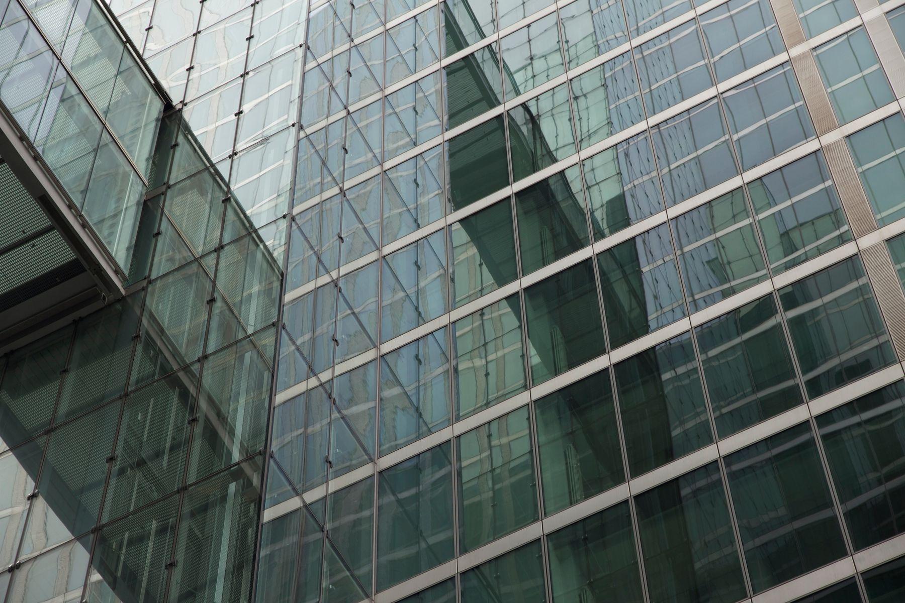 The glass façade of a corporate tower